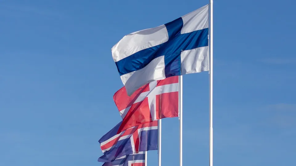 white red and blue striped flag under blue sky during daytime