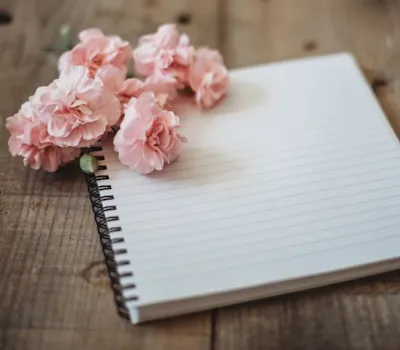 spring flowers sitting on top of a notepad