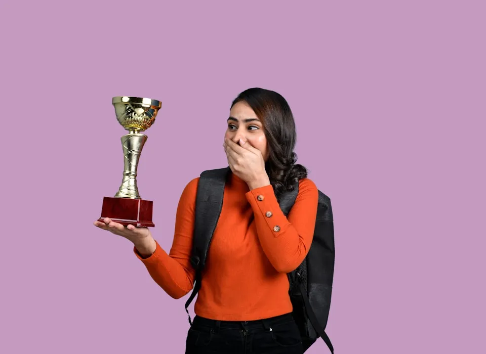 a woman holding a trophy